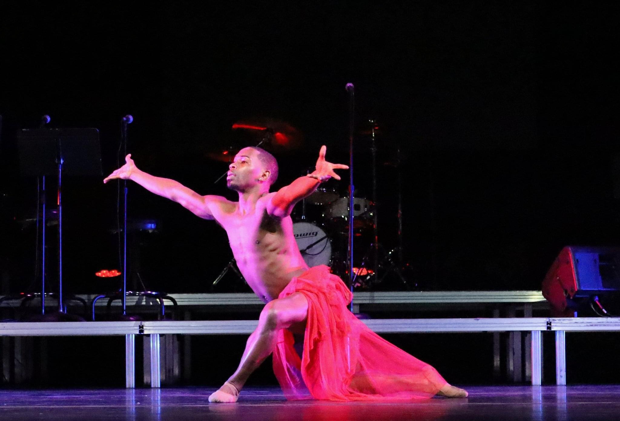 Garrett performing contemporary dance on stage