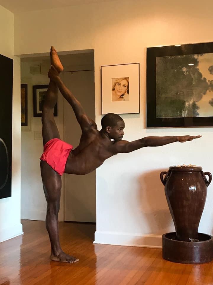 Garrett in standing bow yoga pose